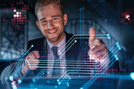 Portrait of handsome businessman in formal suit thinking how to optimize business process by...