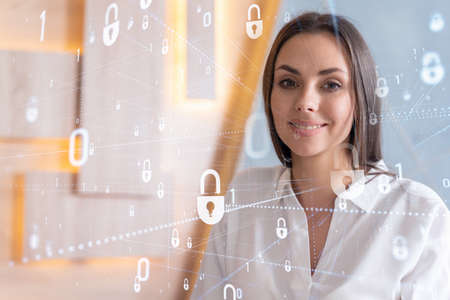 Portrait of attractive smiling businesswoman thinking how to protect clients confidential...