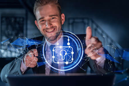 Portrait of handsome businessman thinking how to protect clients confidential information and cyber...