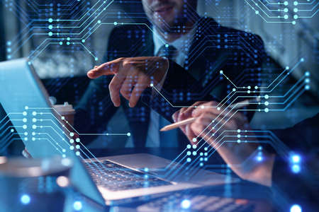 Two colleagues in formal wear working together to optimize business process by applying new...