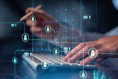 Hands of hr specialist is typing the keyboard in the internet to find the best candidates to create...