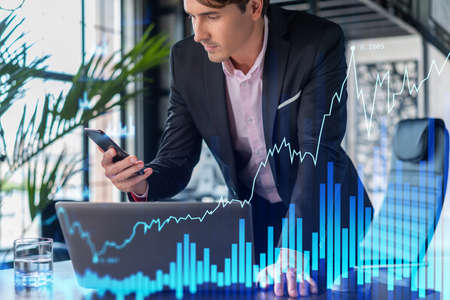 Businessman in suit using smart phone to optimize trading strategy at corporate finance fund. Forex...