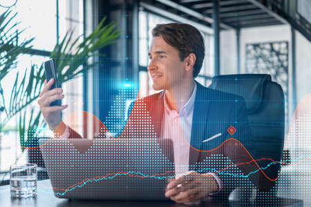 Businessman in suit using smart phone to optimize trading strategy at corporate finance fund. Forex...