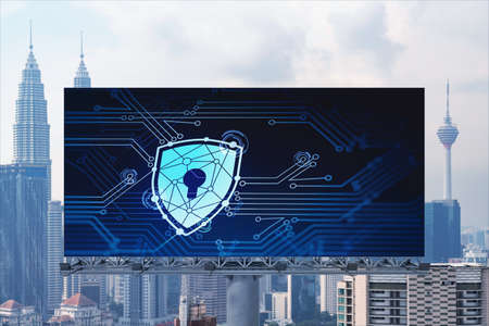 Padlock icon hologram on road billboard over panorama city view of Kuala Lumpur at day time to...