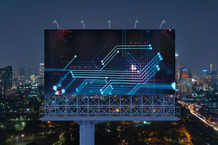 Information flow hologram on road billboard, night panorama city view of Bangkok. The largest...