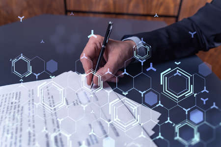 A client in dark blue suit is signing a contract to create a new software to present it in start up...