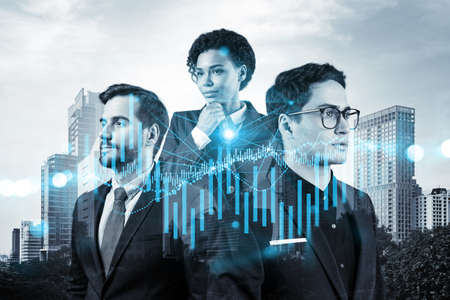 Group of business colleagues in suits as a part of multinational corporate team working on forecasting trading corporate strategy at fund. Forex chart. Bangkok on background. Double exposureの写真素材