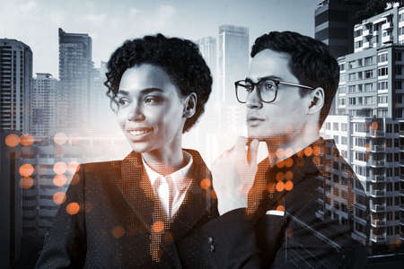 Businessman and businesswoman as a SMM specialists thinking about development of social media...