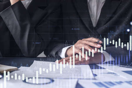 Two traders researching historic data to predict stock market behavior. Women in trading business...