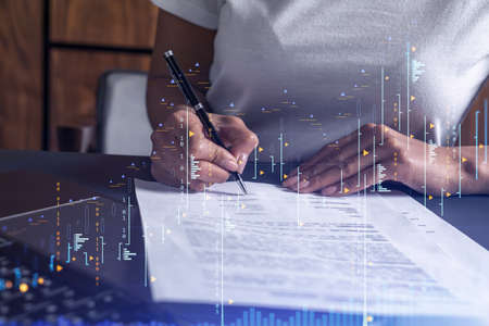 A client in casual wear is signing the contract to invest money in stock market. Internet trading...