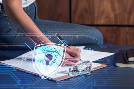 A businesswoman in casual wear signing the contract to prevent probability of risks in cyber...