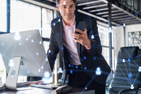 Businessman in suit using smart phone to check new candidates for international business consulting....