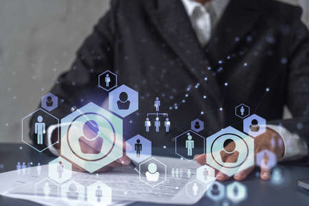 African American businesswoman signing the contract to boost her career and gain new opportunities in personal growth. Hiring new talented crew. Social media hologram icons. Women in business conceptの写真素材