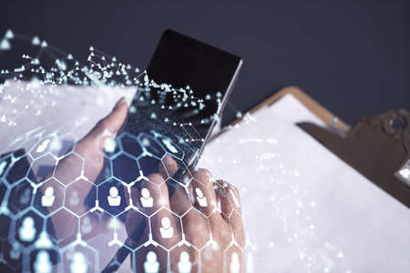 Businesswoman in formal wear checking the phone to sign the employment agreement to boost her career and gain new opportunities in personal growth. Concept of success. Social media hologram iconsの写真素材