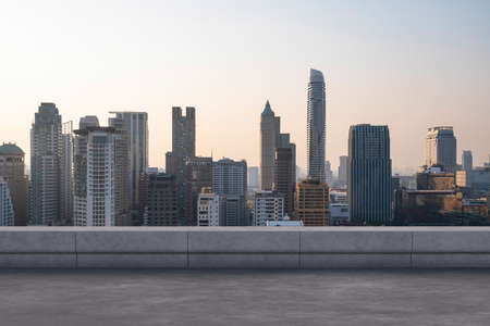 Panoramic Bangkok skyline view, concrete observatory deck on rooftop, sunset. Luxury Asian corporate and residential lifestyle. Financial city downtown, real estate. Product display mockup empty roofの写真素材