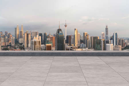 Panoramic Kuala Lumpur skyline view, concrete observatory deck on rooftop, sunset. Asian corporate and residential lifestyle. Financial city downtown, real estate. Product display mockup empty roofの写真素材