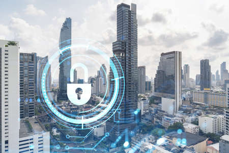 Padlock icon hologram over panorama city view of Bangkok to protect business in Southeast Asia. The...