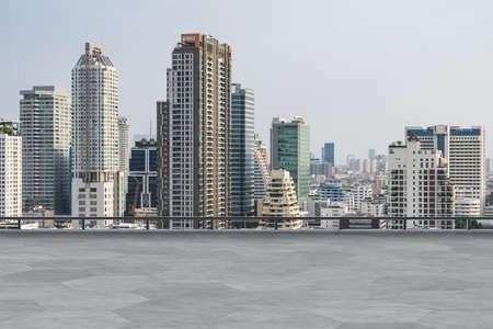 Panoramic Bangkok skyline view, concrete observatory deck on rooftop, daytime. Luxury Asian corporate and residential lifestyle. Financial city downtown, real estate. Product display mockup empty roofの写真素材
