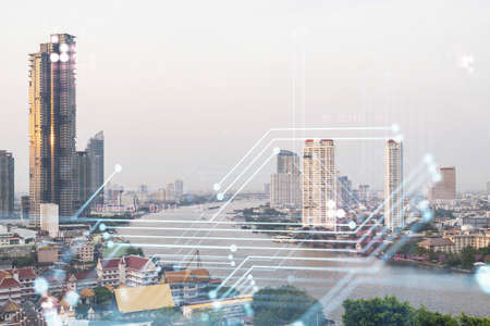 Technology hologram over panorama city view of Bangkok. The largest tech hub in Southeast Asia. The concept of developing coding and high-tech science. Double exposure.の写真素材
