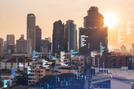 Glowing FOREX graph hologram, aerial panoramic cityscape of Bangkok at sunset. Stock and bond trading in Southeast Asia. The concept of fund management. Double exposure.の写真素材