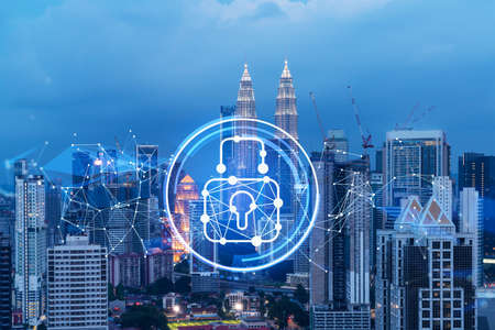 Glowing padlock hologram, night panoramic city view of Kuala Lumpur, Malaysia, Asia. The concept of cyber security shields to protect KL companies. Double exposure.の写真素材