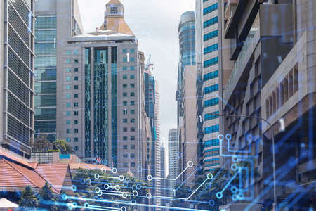 Technology hologram over panorama city view of Singapore. The largest tech hub in Asia. The concept of developing coding and high-tech science. Double exposure.の写真素材