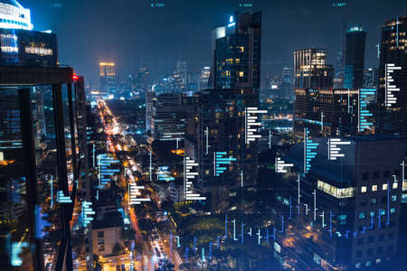 Stock market graph hologram, night panorama city view of Bangkok, popular location to gain financial education in Southeast Asia. The concept of international research. Double exposure.の写真素材