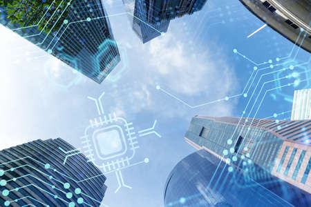 Technology hologram over low angle shot of Singapore skyscrapers. The largest tech hub in Southeast...