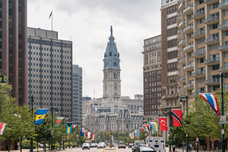 Cityscape of Philadelphia City Hall Clock Tower at summer day time, Pennsylvania, USA. Busy car traffic at business and cultural downtownの写真素材