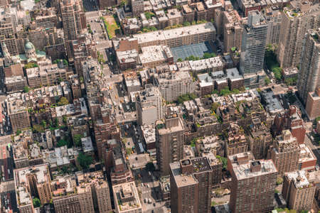 Aerial top view of New York City building roofs. Birds eye view from helicopter of cityscape...