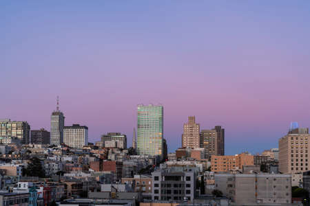 Panoramic cityscape view of San Francisco Nob hill area, which is known as a center of San Francisco upper class residential neighborhoods at purple sunset, midtown, California, United States.の写真素材