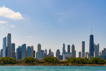 A picturesque view of Downtown skyscrapers of Chicago skyline panorama over Lake Michigan at daytime, Chicago, Illinois, USAの写真素材