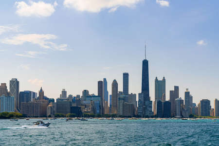 A picturesque view of Downtown skyscrapers of Chicago skyline panorama over Lake Michigan at daytime, Chicago, Illinois, USAの写真素材