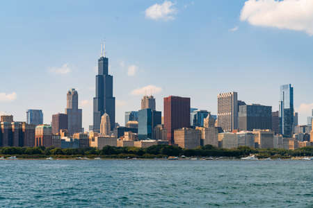A picturesque view of Downtown skyscrapers of Chicago skyline panorama over Lake Michigan at daytime, Chicago, Illinois, USAの写真素材
