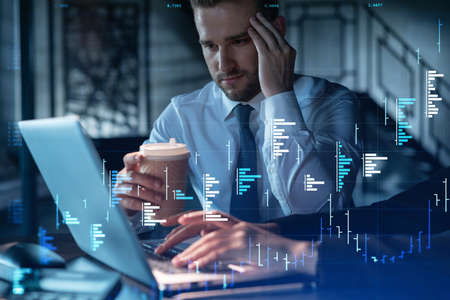 Two colleagues in formal wear working together to optimize trading strategy at corporate finance fund. Forex chart hologram over modern office backgroundの写真素材