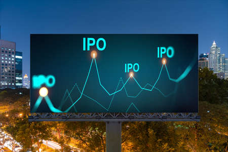 IPO icon hologram on road billboard over night panorama city view of Bangkok. The hub of initial public offering in Southeast Asia. The concept of exceeding business opportunities.の写真素材