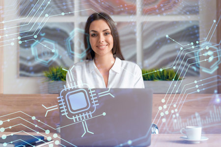 Attractive businesswoman in white shirt at workplace working with laptop to optimize development by...