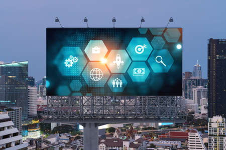 Hologram of Research and Development glowing icons on billboard. Sunset panoramic city view of Bangkok. Concept of innovative technologies to create new services and products in Southeast Asia.の写真素材