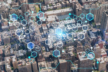 Aerial top view of New York City building roofs. Bird's eye view from helicopter of metropolis cityscape. decentralized economy. Blockchain, cryptography and cryptocurrency concept, hologramの写真素材