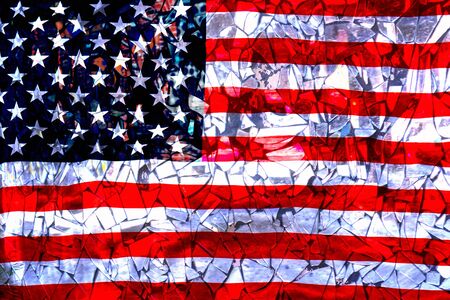 Broken mirrors against the American flag.の写真素材
