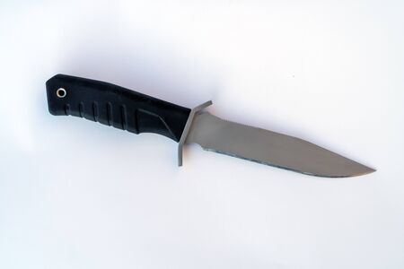Black Army knife on a white background. knife close-up.の写真素材