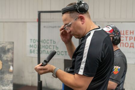 Russia, Tatarstan, June 23, 2019. Shooting training. The man shoots from the gun at the shooting...