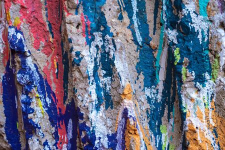 stone painted in different colors: pink, blue, yellow. selective focusの写真素材