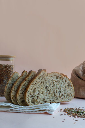 classic artisan healthy tartine bread with sesame, sunflower, flax seeds in cross section, showing...