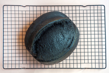 View from above Creative and unusual handmade black sourdough bread.