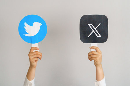old and new twitter logo. Girl holding twitter icon cards. Turkey, Istanbul, September 17, 2024.のeditorial素材