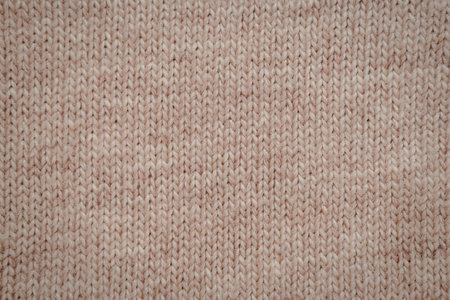 A close-up view of a brown fabric texture, showcasing its intricate weave pattern.