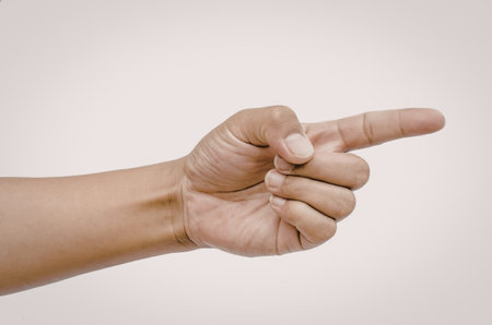 An image of a human hand with the index finger pointing to the right against a white background.