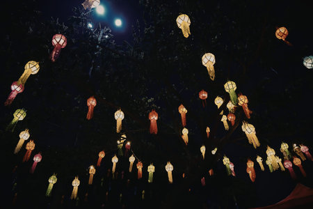 A mesmerizing display of colorful lanterns floating in the night sky, creating a vibrant and...