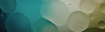 An image of colorful gradient bubbles in shades of blue, green, and yellow.